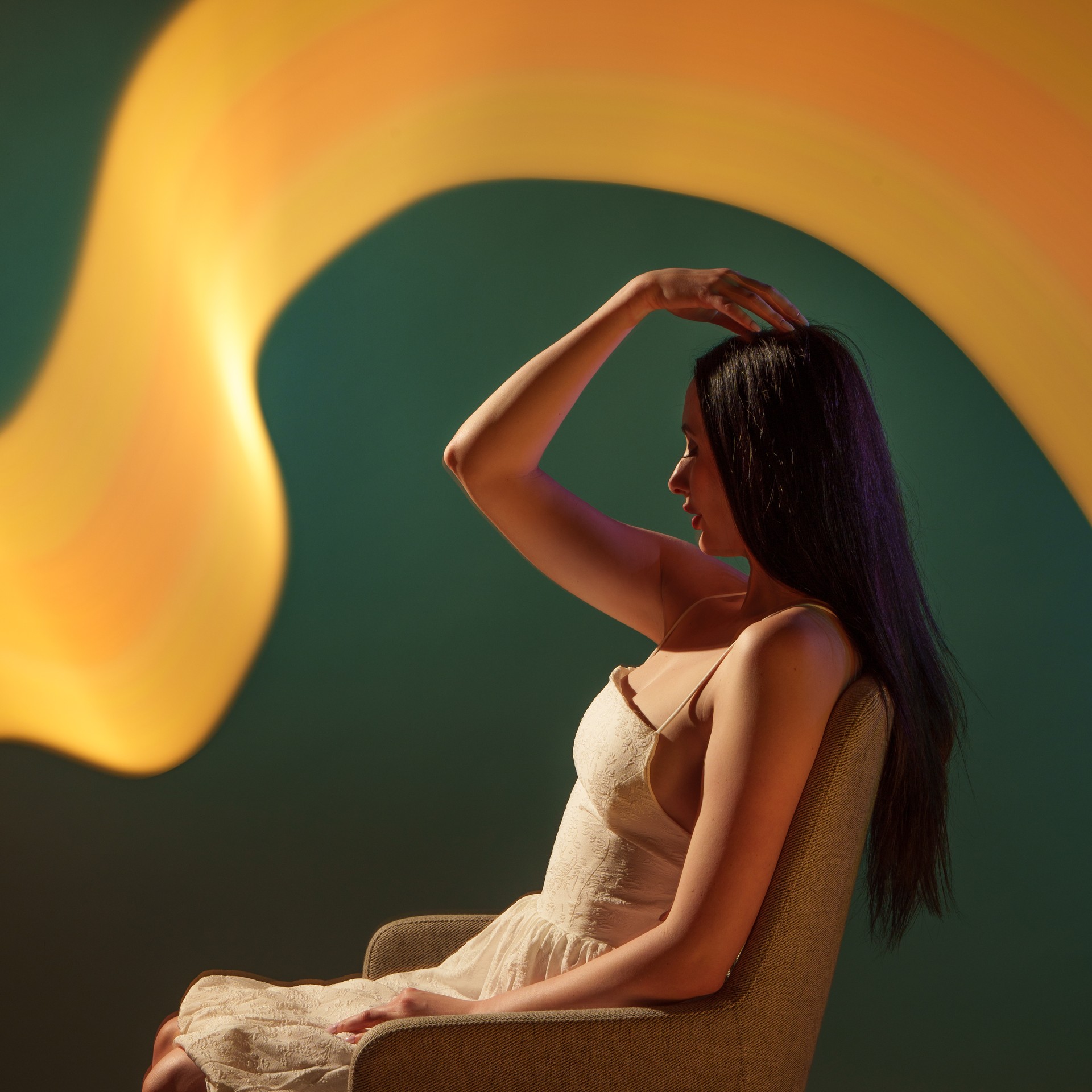 Light painting with model in chair